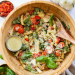 This Creamy Pesto Pasta Salad is the best dairy-free salad. Serve it as a main course or a side salad for a fresh, tasty vegan recipe idea | ThisSavoryVegan.com #thissavoryvegan #pastasaladrecipes #dairyfreepesto