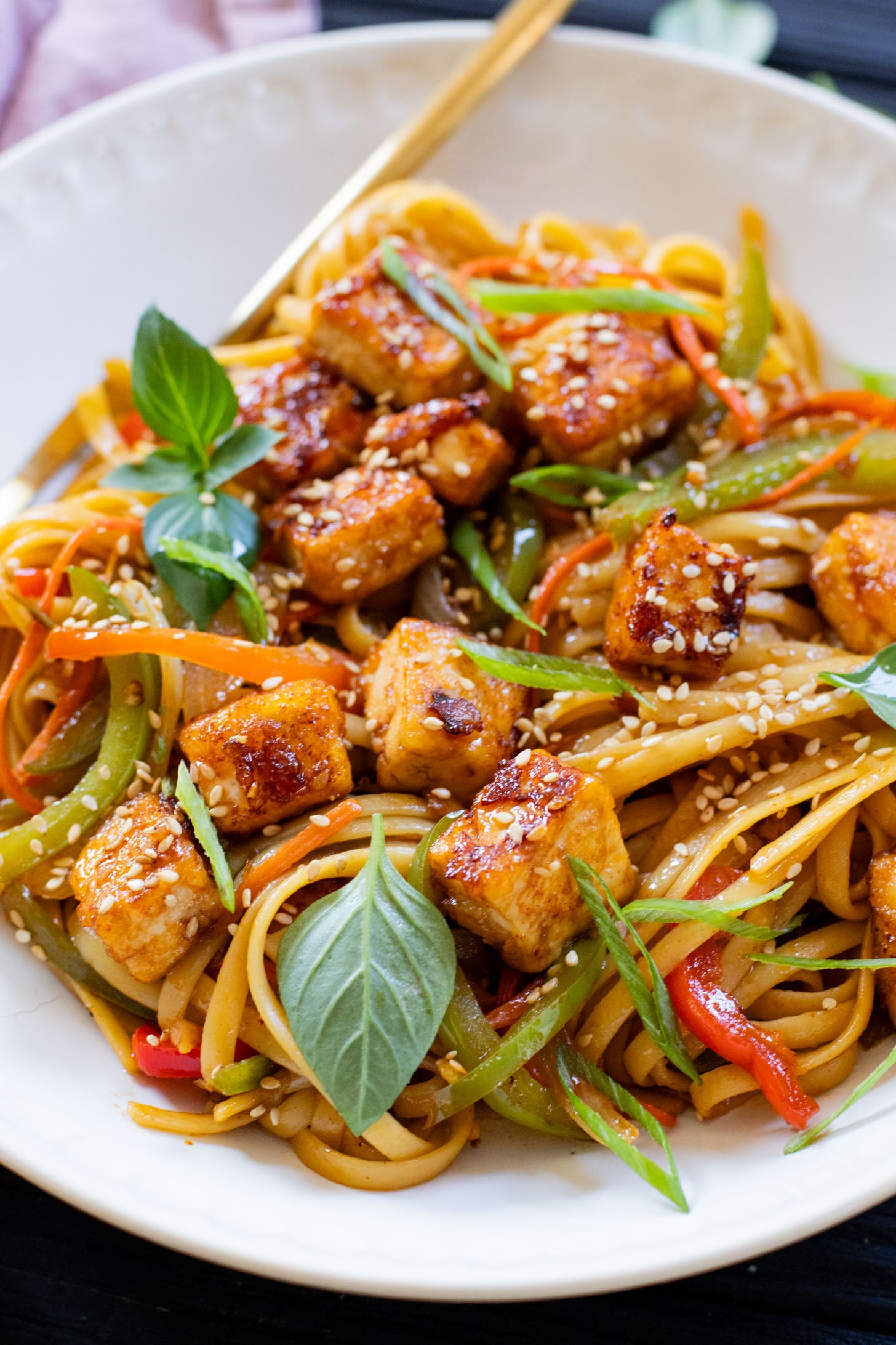 This Tofu Noodle Stir-Fry is loaded with crispy tofu, tons of veggies and noodles tossed in a homemade vegan stir-fry sauce | ThisSavoryVegan.com #thissavoryvegan #vegannoodles #veganstirfry