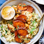 These Fall Harvest Grain Bowls are a healthy vegan dinner - filled with roasted sweet potato & cauliflower, a creamy orzo and a side of hummus | ThisSavoryVegan.com #thissavoryvegan #fallrecipes #falldinnnerideas
