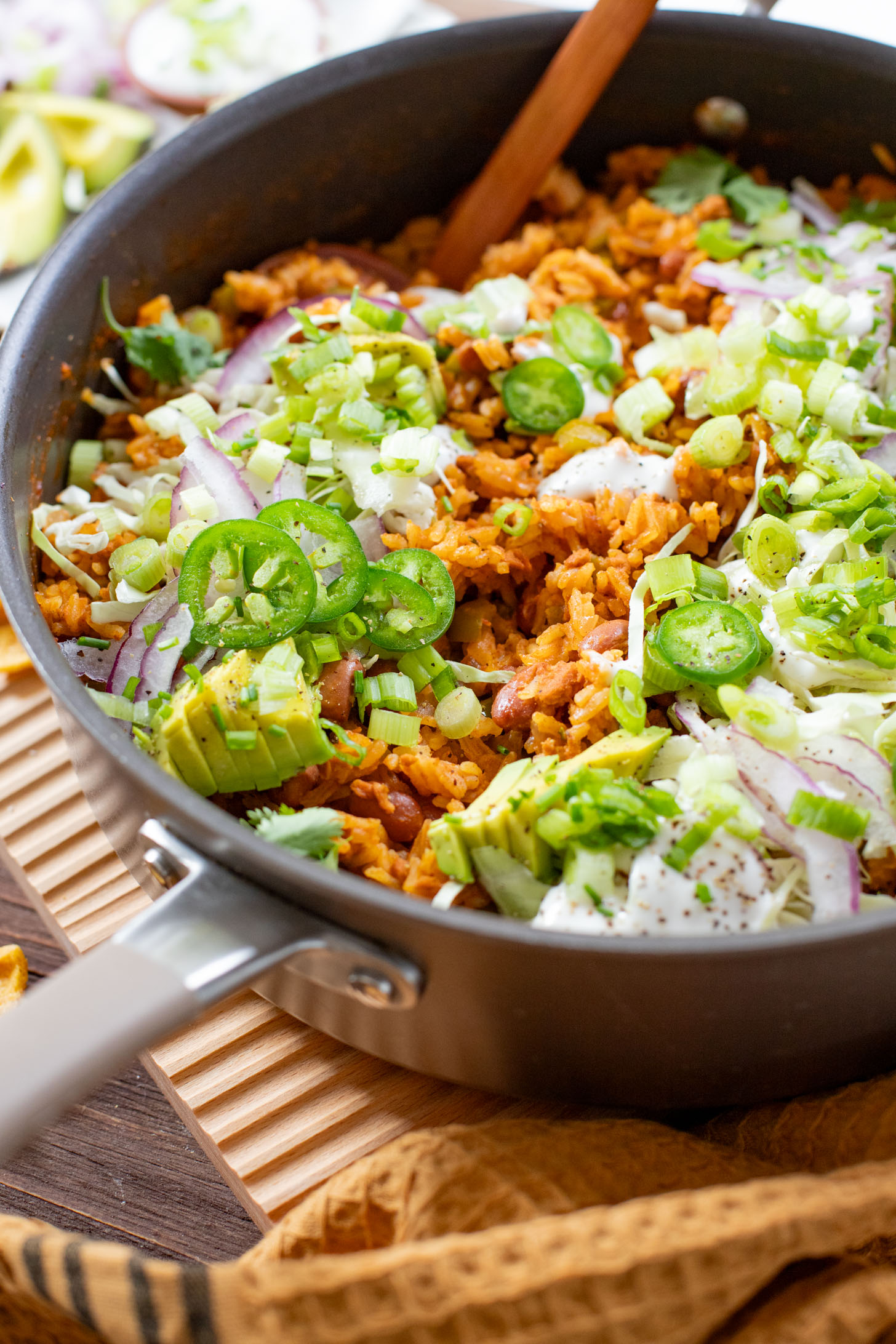 This Green Chile Rice Skillet is a one-pot vegan recipe filled with beans, rice, veggies & soyrizo. Served up with so many delicious toppings | ThisSavoryVegan.com #onepotrecipes #easyvegandinners #thissavoryvegan