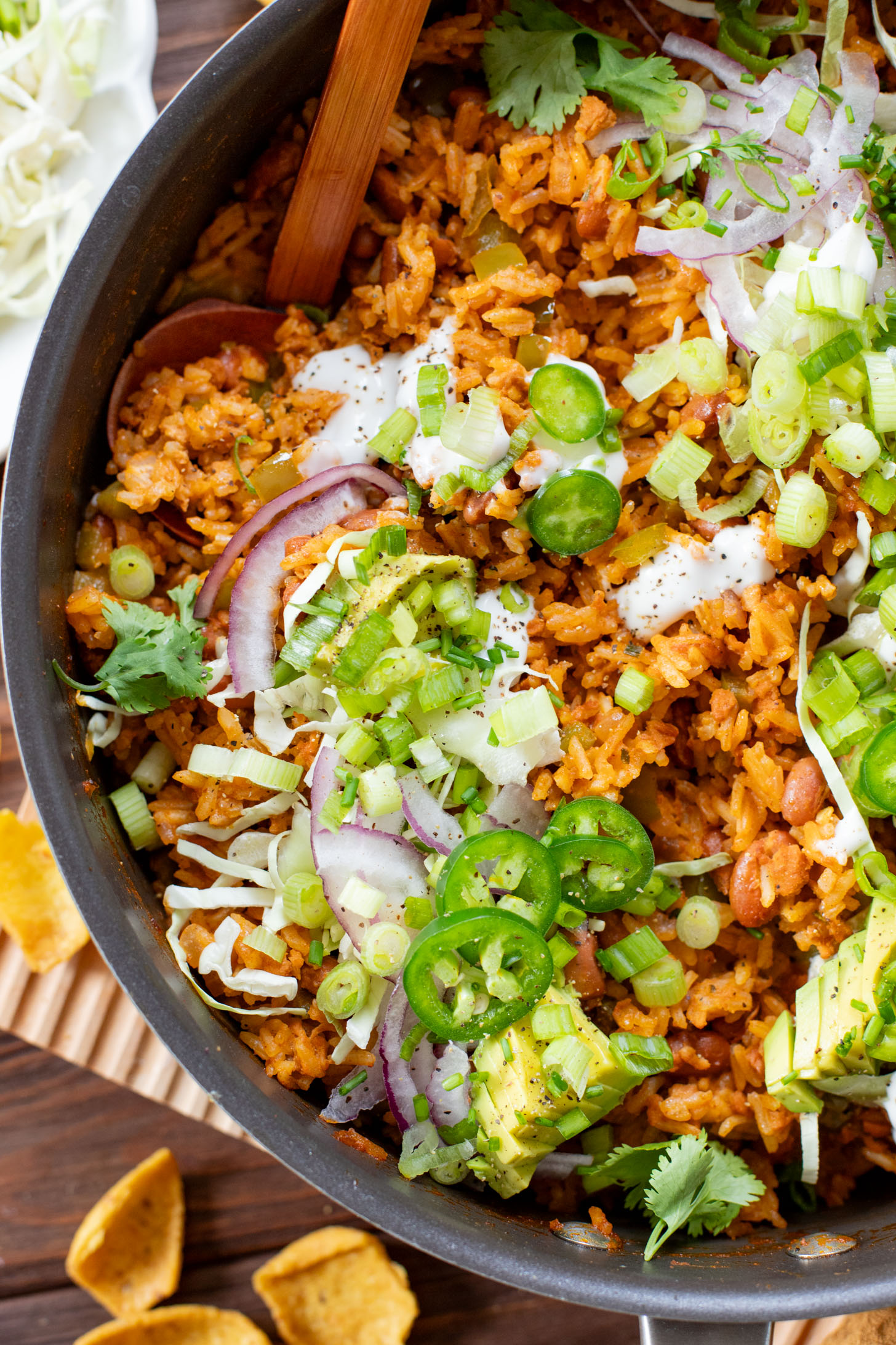 This Green Chile Rice Skillet is a one-pot vegan recipe filled with beans, rice, veggies & soyrizo. Served up with so many delicious toppings | ThisSavoryVegan.com #onepotrecipes #easyvegandinners #thissavoryvegan