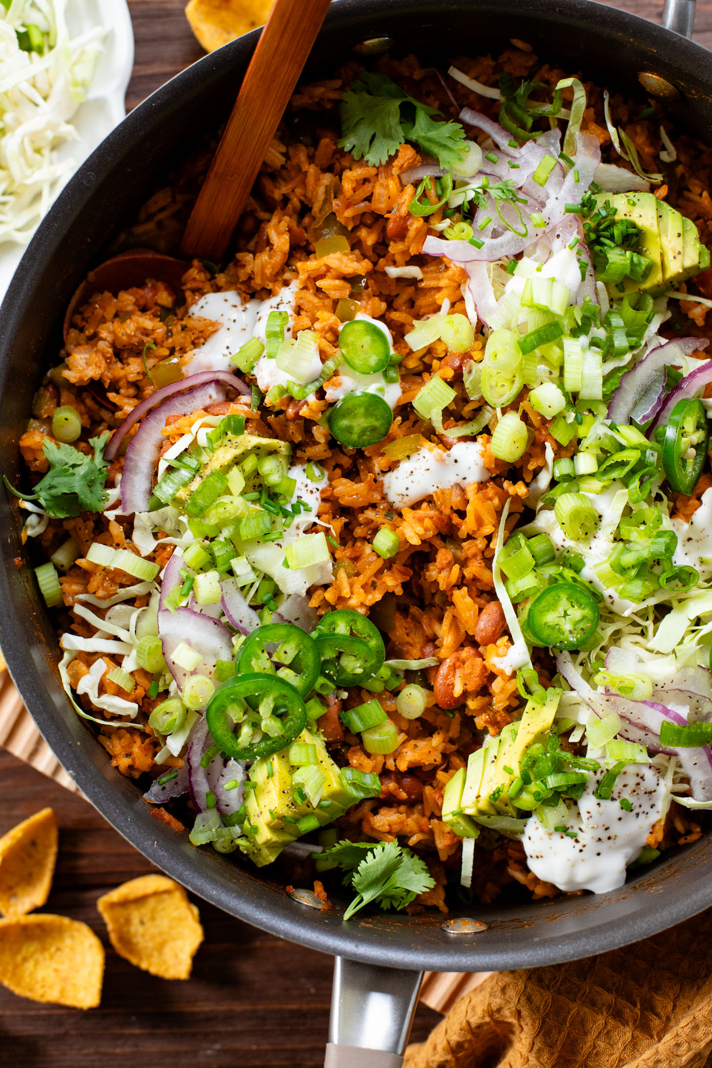 This Green Chile Rice Skillet is a one-pot vegan recipe filled with beans, rice, veggies & soyrizo. Served up with so many delicious toppings | ThisSavoryVegan.com #onepotrecipes #easyvegandinners #thissavoryvegan