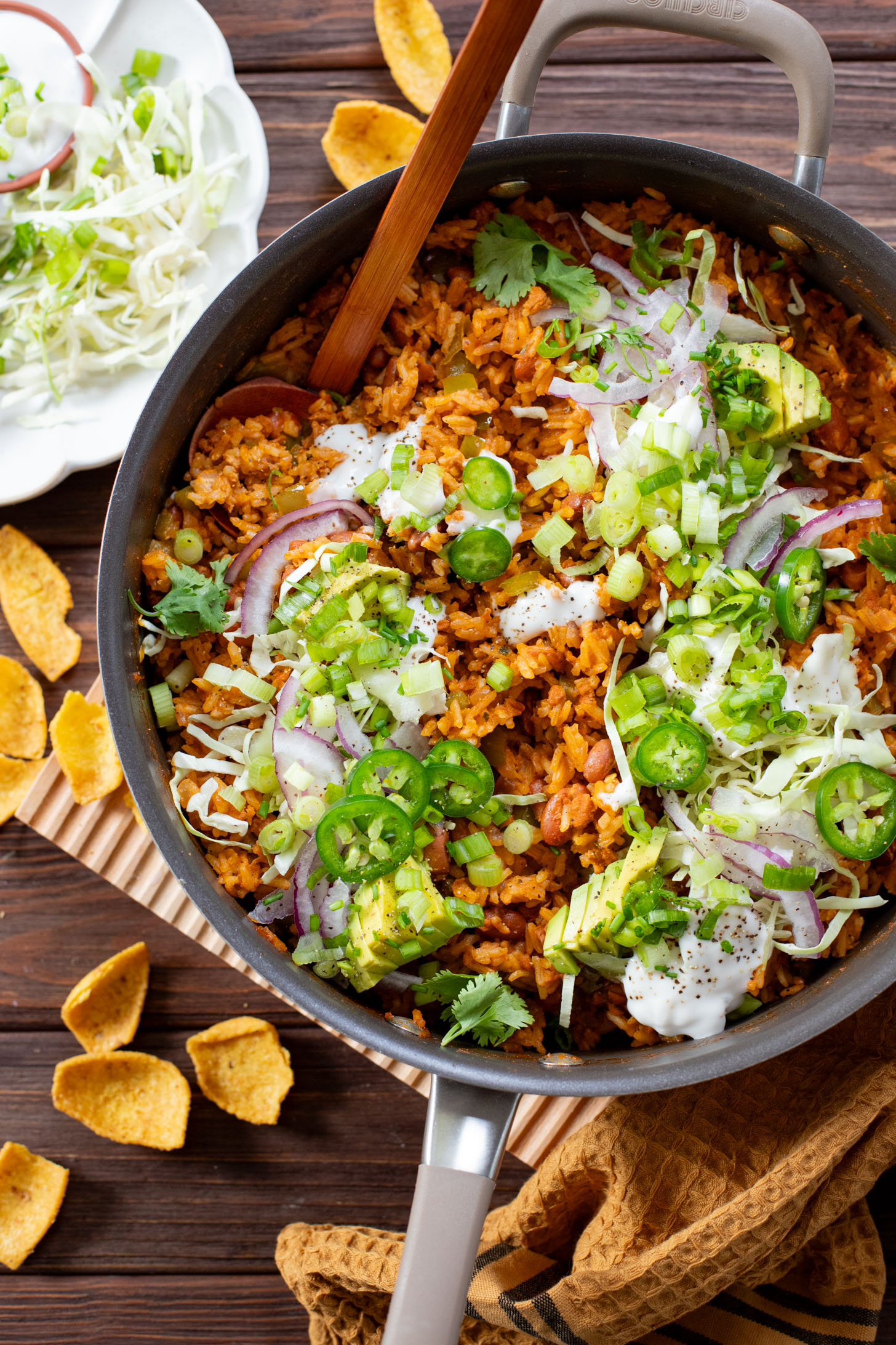 This Green Chile Rice Skillet is a one-pot vegan recipe filled with beans, rice, veggies & soyrizo. Served up with so many delicious toppings | ThisSavoryVegan.com #onepotrecipes #easyvegandinners #thissavoryvegan