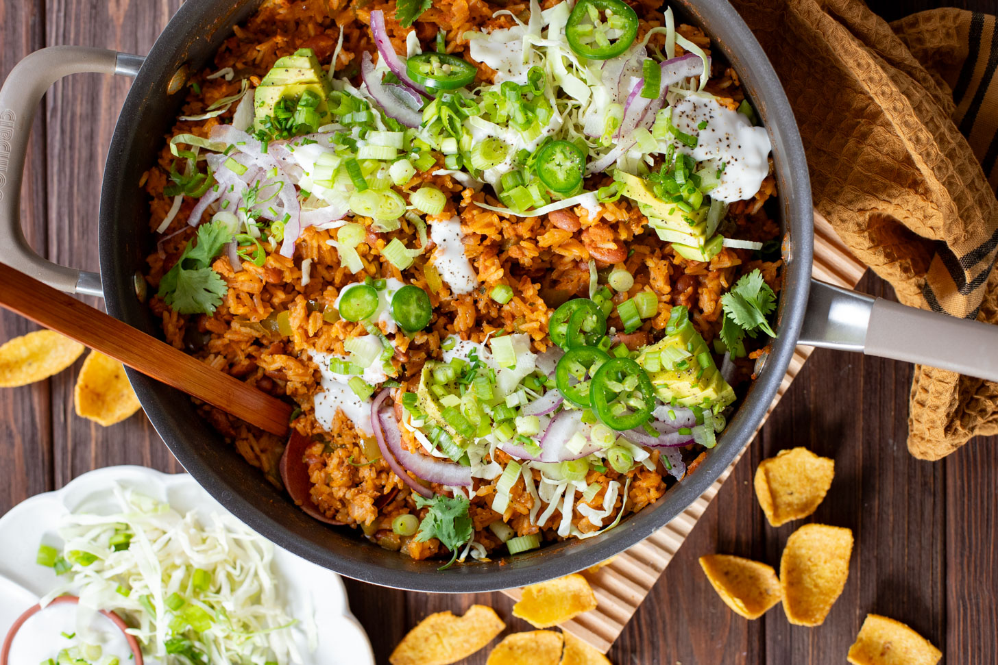 This Green Chile Rice Skillet is a one-pot vegan recipe filled with beans, rice, veggies & soyrizo. Served up with so many delicious toppings | ThisSavoryVegan.com #onepotrecipes #easyvegandinners #thissavoryvegan