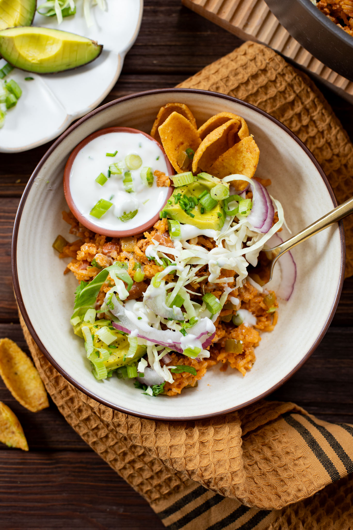 This Green Chile Rice Skillet is a one-pot vegan recipe filled with beans, rice, veggies & soyrizo. Served up with so many delicious toppings | ThisSavoryVegan.com #onepotrecipes #easyvegandinners #thissavoryvegan