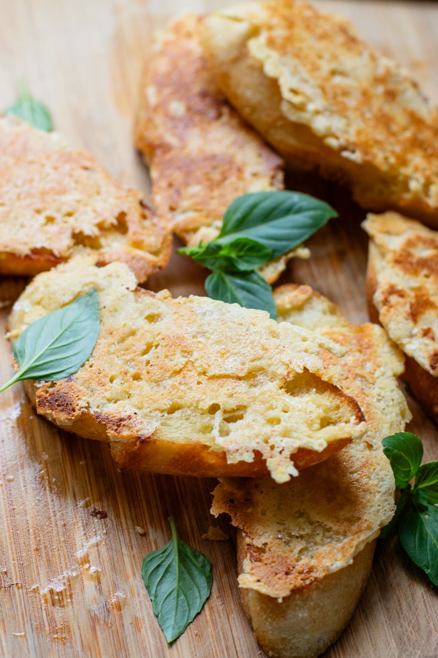 This Roasted Garlic Tomato Soup is creamy, savory & delicious. Served with vegan parmesan toast and topped with fresh basil | ThisSavoryVegan.com #tomatosoup #soupseason #vegansoup