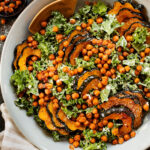This Acorn Squash Kale Caesar Salad is made with the best vegan caesar dressing and topped with roasted squash and crispy chickpeas | ThisSavoryVegan.com #vegancaesar #fallsalads #dairyfreecaesar