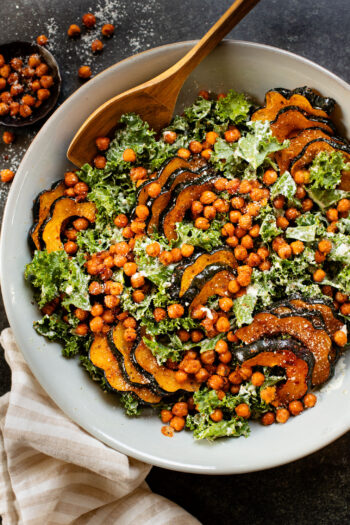 This Acorn Squash Kale Caesar Salad is made with the best vegan caesar dressing and topped with roasted squash and crispy chickpeas | ThisSavoryVegan.com #vegancaesar #fallsalads #dairyfreecaesar