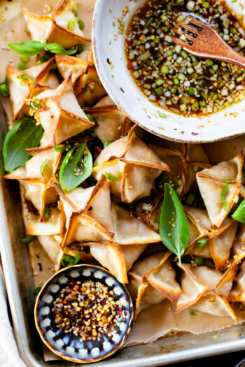 These Baked Butternut Squash Wontons are filled with roasted squash and served with a homemade dipping sauce. The most comforting vegan appetizer | ThisSavoryVegan.com #thissavoryvegan #veganwontons #vegandumplings