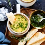 This Creamy Broccoli & Orzo Soup is dairy-free, veggie-packed and super delicious. Topped with an herby olive oil - this is comfort in a bowl | ThisSavoryVegan.com #thissavoryvegan #vegansoup #dairyfreesoup