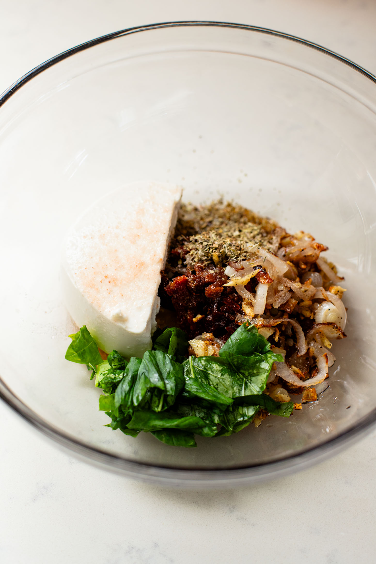 These Pumpkin Shaped Pizza Bites are stuffed with a mediterranean, dairy-free filling that is delicious! The perfect vegan fall recipe | ThisSavoryVegan.com #halloweenrecipes #thanksgivingrecipes #thanksgivingappetizers