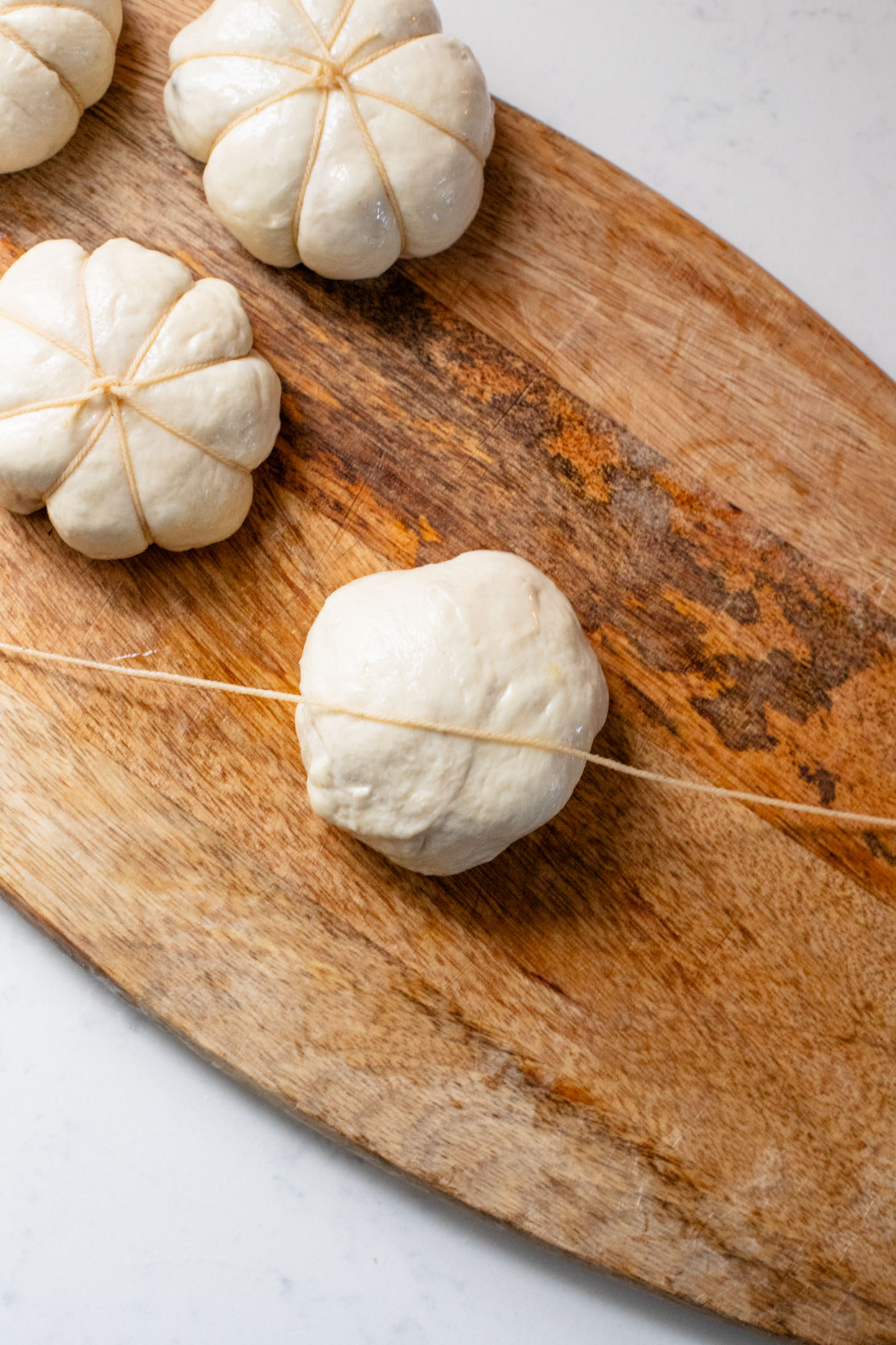 These Pumpkin Shaped Pizza Bites are stuffed with a mediterranean, dairy-free filling that is delicious! The perfect vegan fall recipe | ThisSavoryVegan.com #halloweenrecipes #thanksgivingrecipes #thanksgivingappetizers