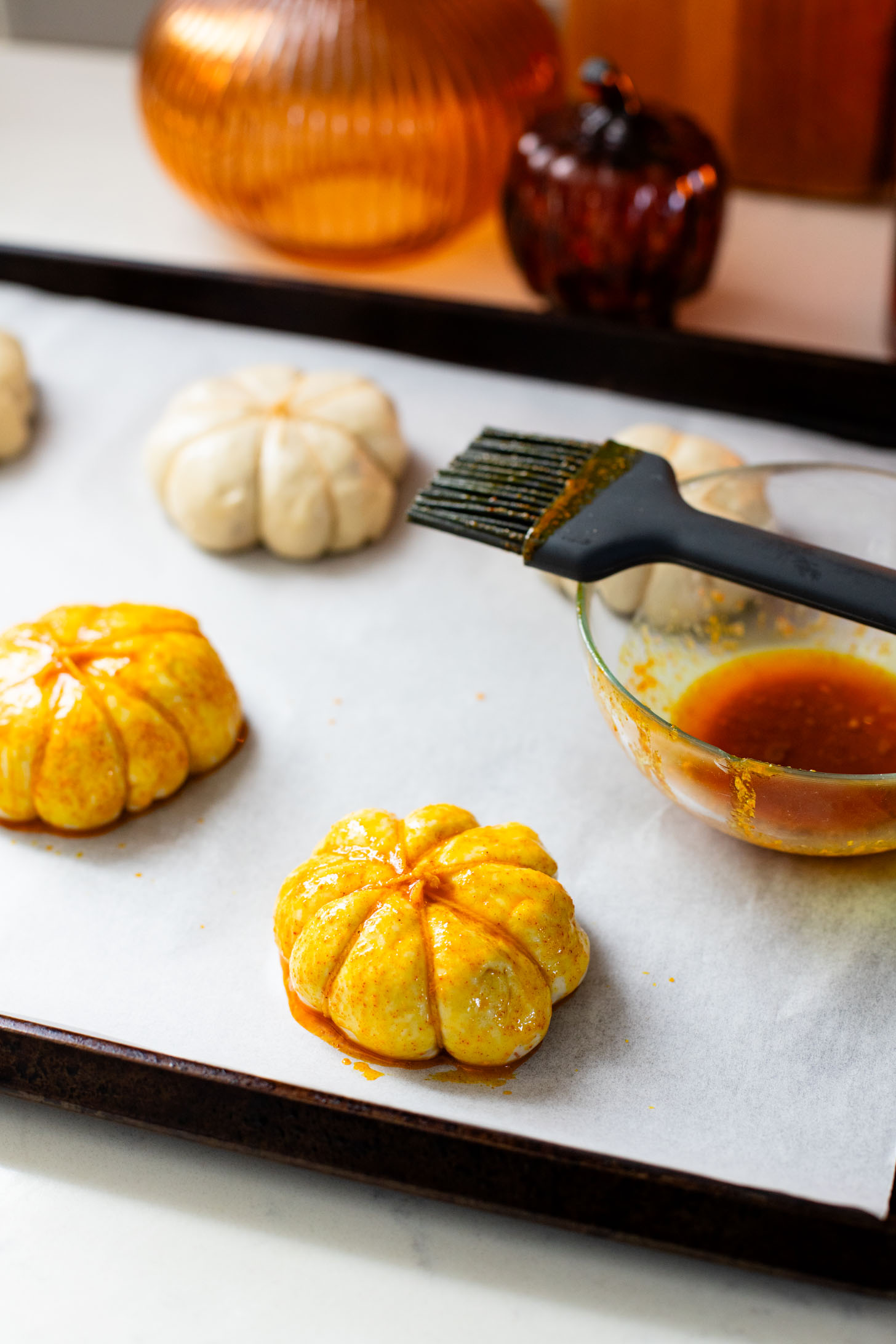 These Pumpkin Shaped Pizza Bites are stuffed with a mediterranean, dairy-free filling that is delicious! The perfect vegan fall recipe | ThisSavoryVegan.com #halloweenrecipes #thanksgivingrecipes #thanksgivingappetizers