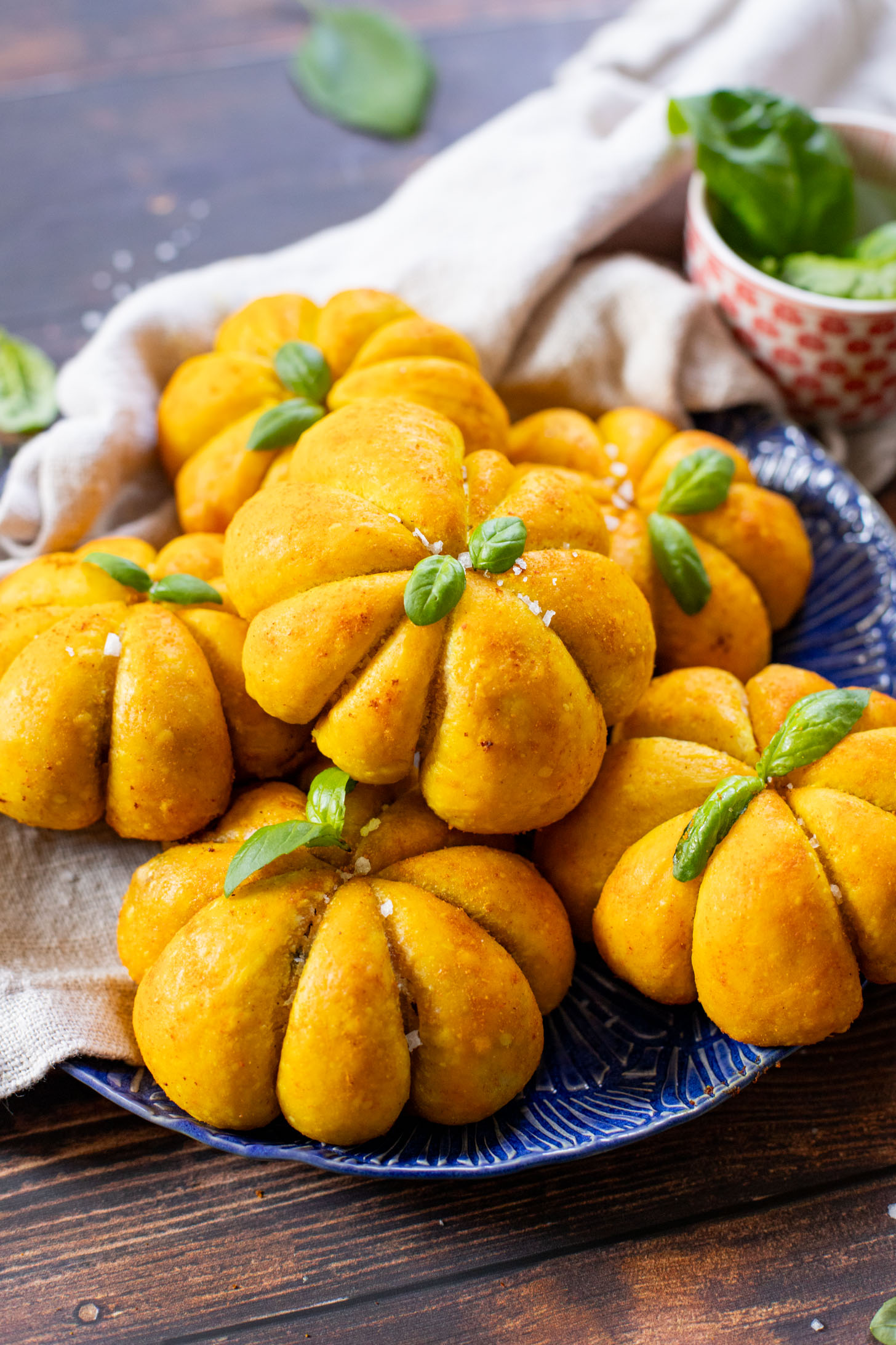These Pumpkin Shaped Pizza Bites are stuffed with a mediterranean, dairy-free filling that is delicious! The perfect vegan fall recipe | ThisSavoryVegan.com #halloweenrecipes #thanksgivingrecipes #thanksgivingappetizers