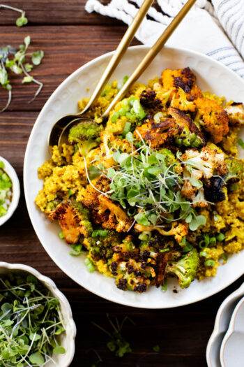 Simple and delicious, this Roasted Cauliflower & Curried Quinoa has Indian-inspired flavors and is ready in 35 minutes. A quick vegan weeknight dinner | ThisSavoryVegan.com #thissavoryvegan #quinoarecipes #roastedveggies