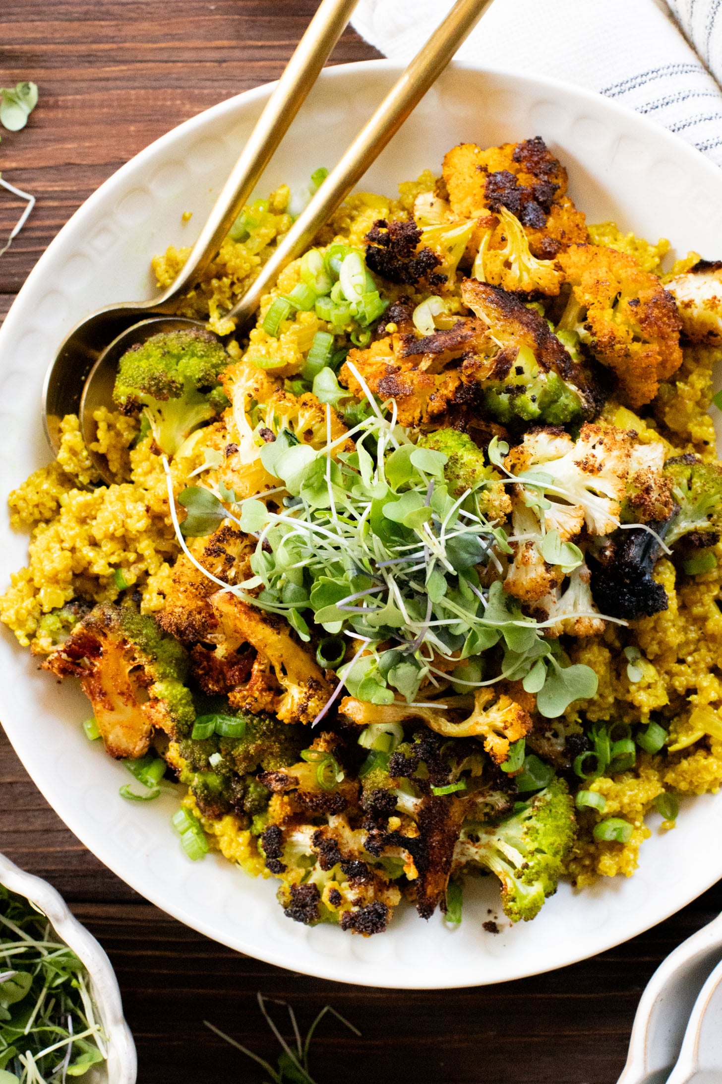 Simple and delicious, this Roasted Cauliflower & Curried Quinoa has Indian-inspired flavors and is ready in 35 minutes. A quick vegan weeknight dinner | ThisSavoryVegan.com #thissavoryvegan #quinoarecipes #roastedveggies