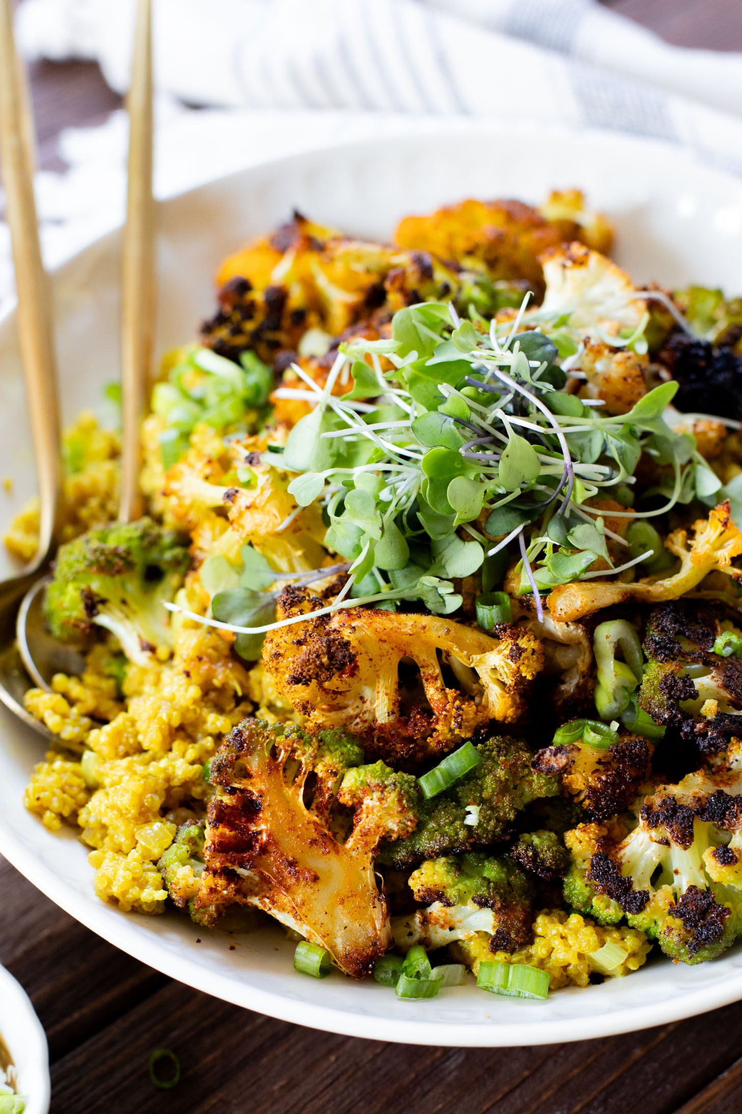 Simple and delicious, this Roasted Cauliflower & Curried Quinoa has Indian-inspired flavors and is ready in 35 minutes. A quick vegan weeknight dinner | ThisSavoryVegan.com #thissavoryvegan #quinoarecipes #roastedveggies
