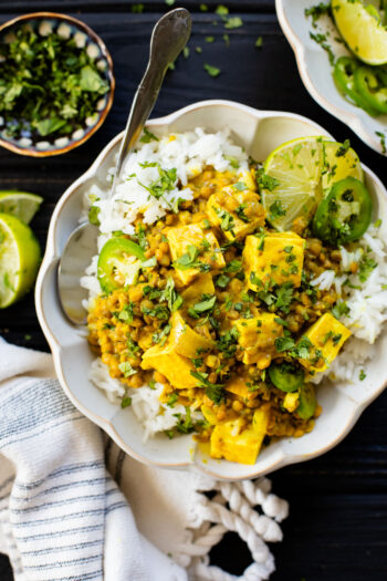 Comforting, healthy and delicious, this Tofu & Lentil Pumpkin Curry uses Indian-inspired flavors and is served up over rice for a comforting vegan dinner | ThisSavoryVegan.com #vegancurry #easycurry #pumpkinrecipes