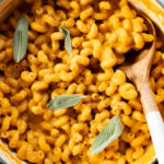 This vegan Butternut Squash Mac & Cheese is creamy, delicious and full of fall flavors. This is the perfect vegan holiday side dish | ThisSavoryVegan.com #thissavoryvegan #veganthanksgiving #veganmacandcheese