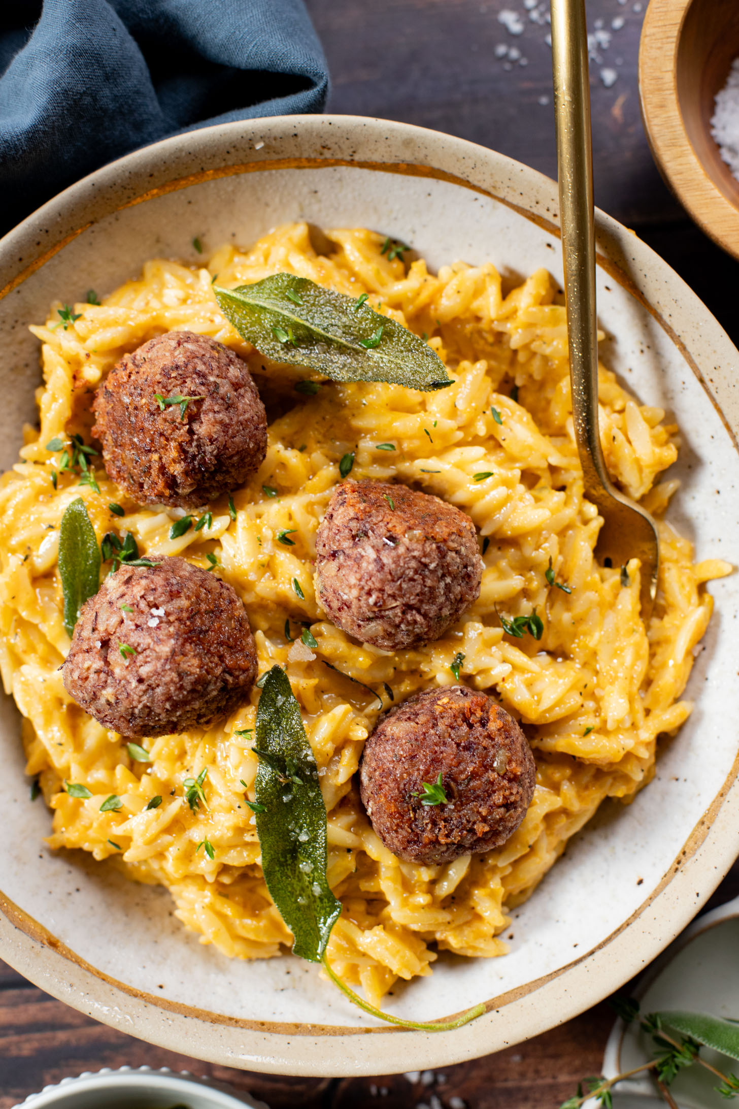 This Butternut Squash Orzo & Bean Meatballs recipe is a fall dinner dream! Orzo tossed in a butternut squash sauce, kidney bean "meatballs" and vegan brown butter & sage drizzle | ThisSavoryVegan.com #thissavoryvegan #veganmeatballs #falldinnerrecipes