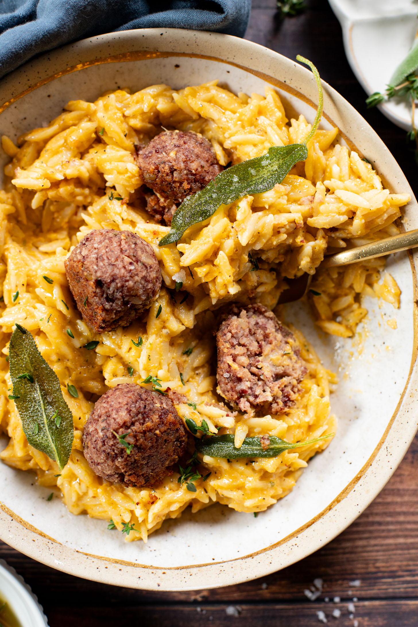 This Butternut Squash Orzo & Bean Meatballs recipe is a fall dinner dream! Orzo tossed in a butternut squash sauce, kidney bean "meatballs" and vegan brown butter & sage drizzle | ThisSavoryVegan.com #thissavoryvegan #veganmeatballs #falldinnerrecipes