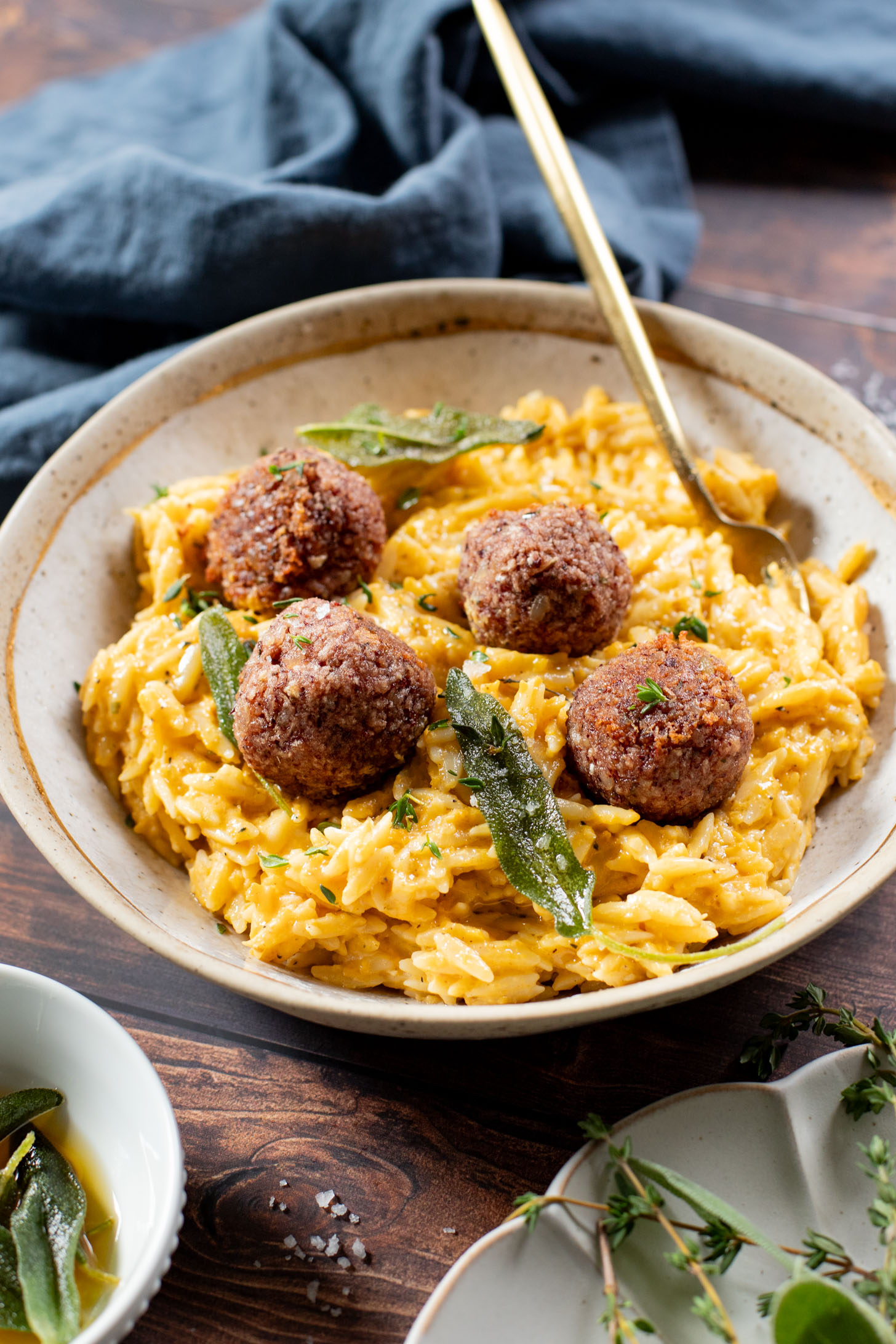 This Butternut Squash Orzo & Bean Meatballs recipe is a fall dinner dream! Orzo tossed in a butternut squash sauce, kidney bean "meatballs" and vegan brown butter & sage drizzle | ThisSavoryVegan.com #thissavoryvegan #veganmeatballs #falldinnerrecipes