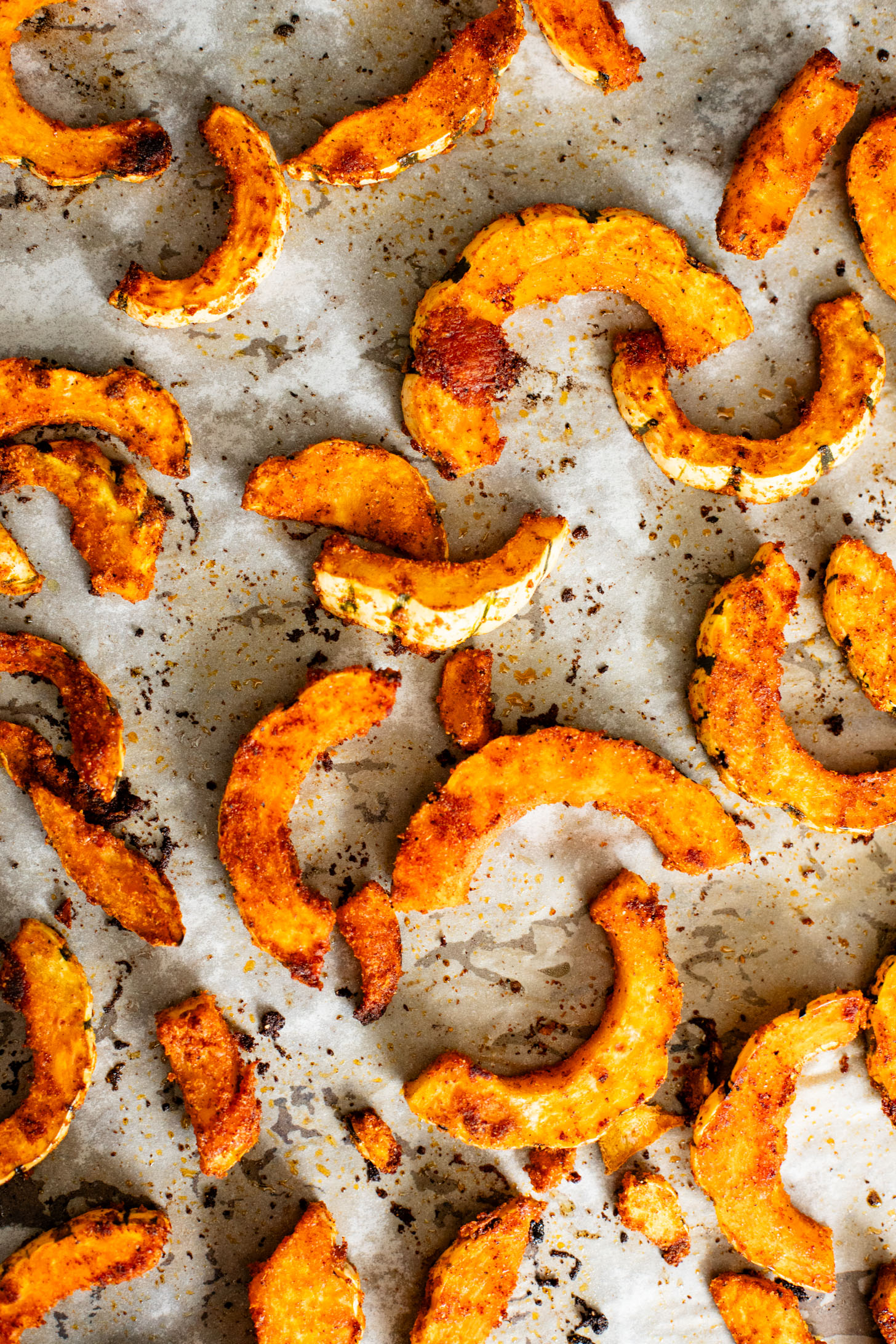 This Roasted Squash & Lentils recipe is a mix between a salad and a bowl. Crispy delicata squash, vegan feta and lemony lentils with fresh herbs | ThisSavoryVegan.com #thissavoryvegan #squashrecipes #fallrecipes