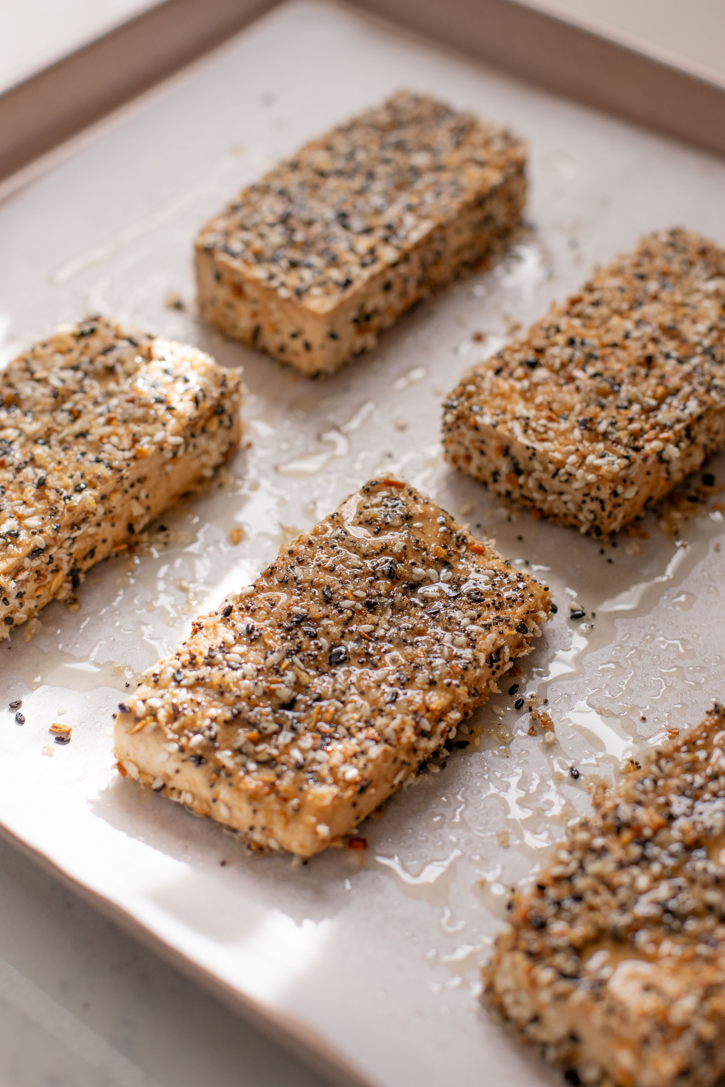 This Sesame Crusted Tofu Brussels Sprouts Salad is quick, light and protein packed. Raw shaved brussels sprouts and baked tofu in a maple dressing | ThisSavoryVegan.com #thissavoryvegan #bakedtofu #easytofurecipes