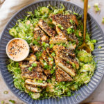 This Sesame Crusted Tofu Brussels Sprouts Salad is quick, light and protein packed. Raw shaved brussels sprouts and baked tofu in a maple dressing | ThisSavoryVegan.com #thissavoryvegan #bakedtofu #easytofurecipes