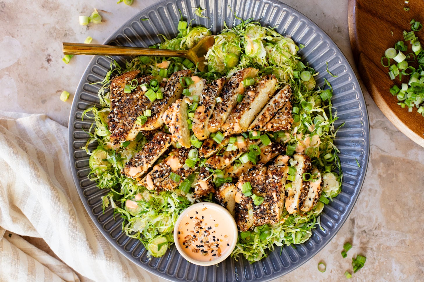 This Sesame Crusted Tofu Brussels Sprouts Salad is quick, light and protein packed. Raw shaved brussels sprouts and baked tofu in a maple dressing | ThisSavoryVegan.com #thissavoryvegan #bakedtofu #easytofurecipes