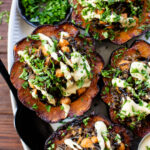 This Wild Rice Stuffed Acorn Squash recipe is filled with fall flavors. The squash is roasted until tender and stuffed with wild rice & chickpeas | ThisSavoryVegan.com #fallrecipes #wildricerecipes #falldinnerideas