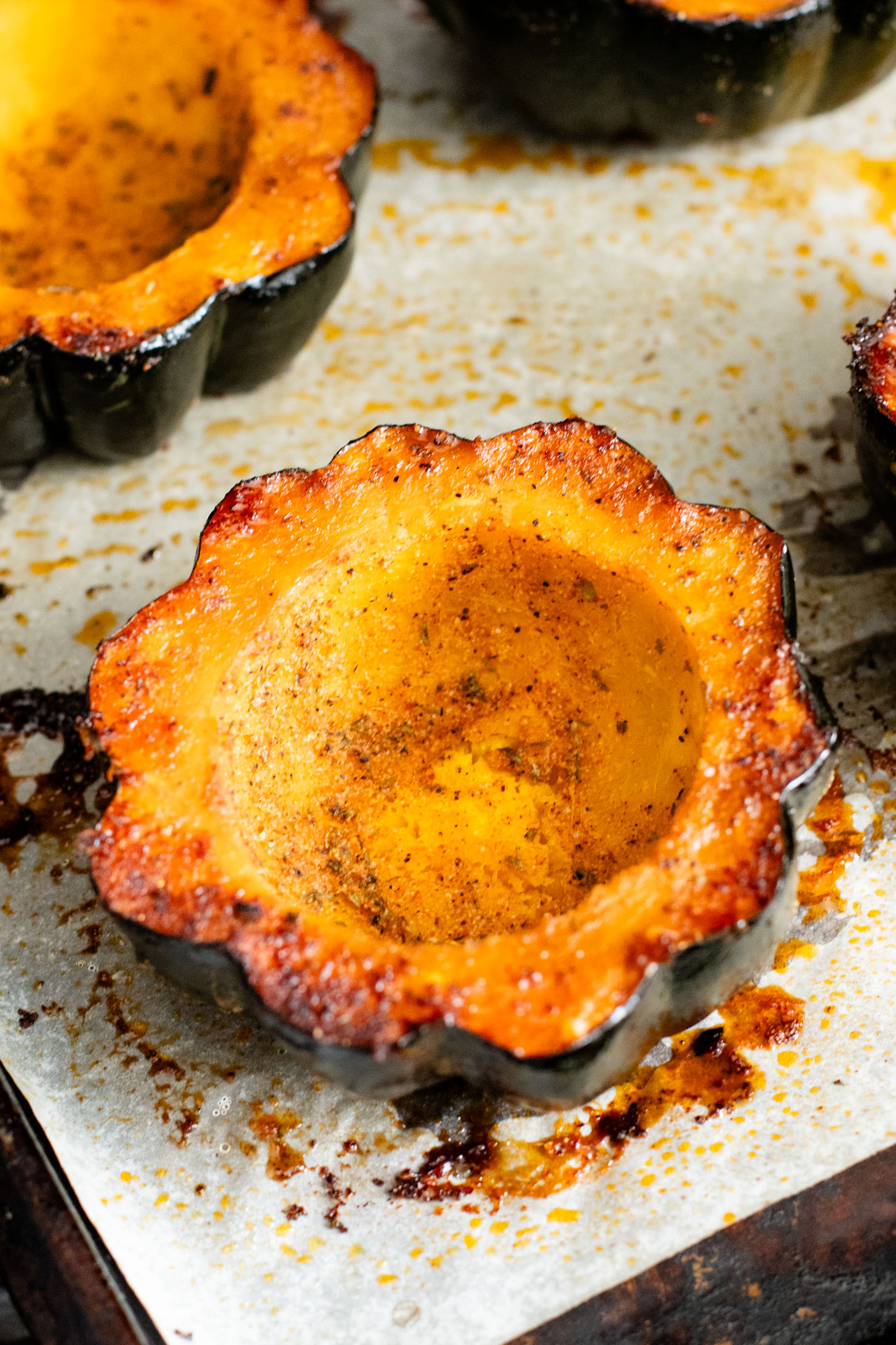 This Wild Rice Stuffed Acorn Squash recipe is filled with fall flavors. The squash is roasted until tender and stuffed with wild rice & chickpeas | ThisSavoryVegan.com #fallrecipes #wildricerecipes #falldinnerideas