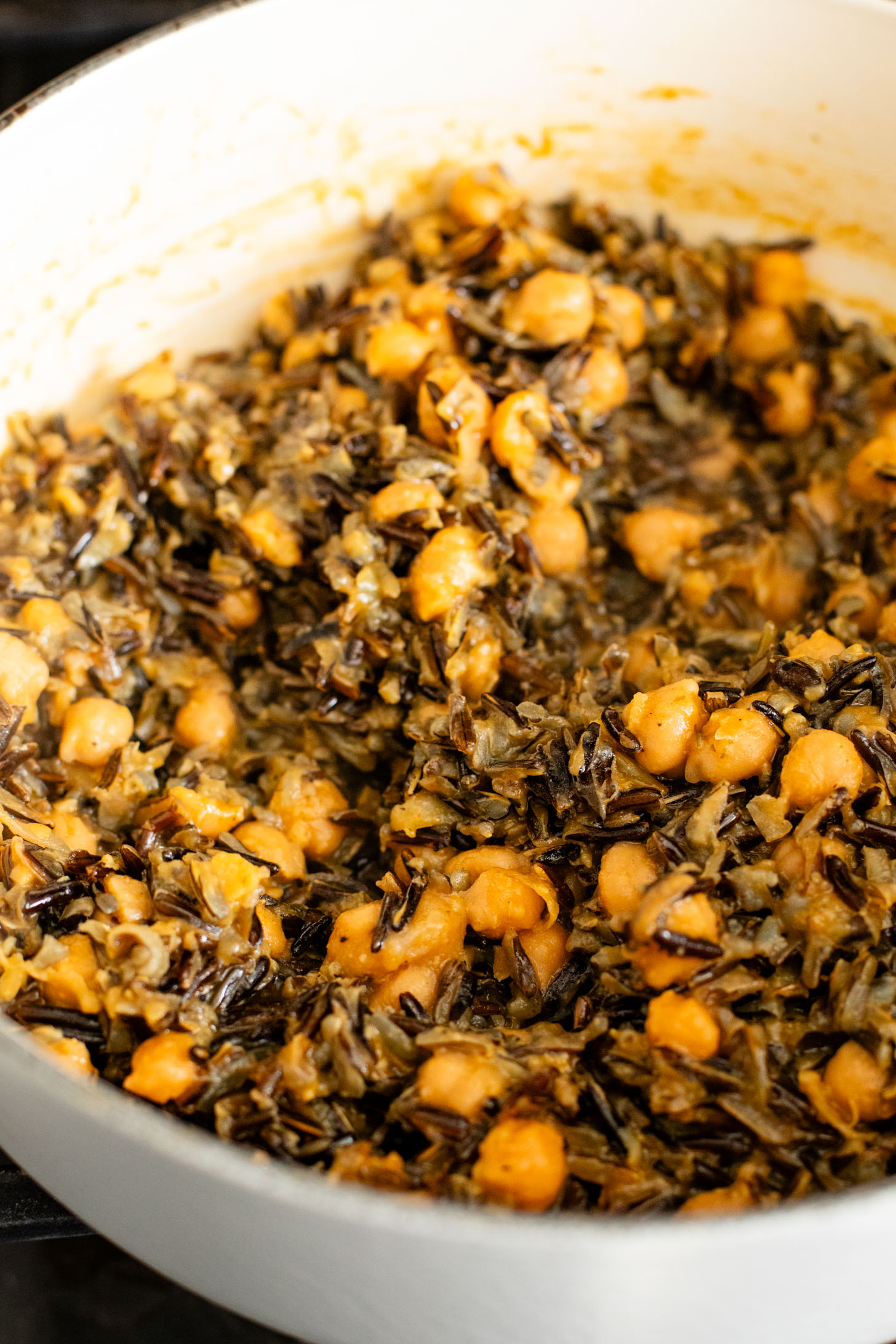 This Wild Rice Stuffed Acorn Squash recipe is filled with fall flavors. The squash is roasted until tender and stuffed with wild rice & chickpeas | ThisSavoryVegan.com #fallrecipes #wildricerecipes #falldinnerideas