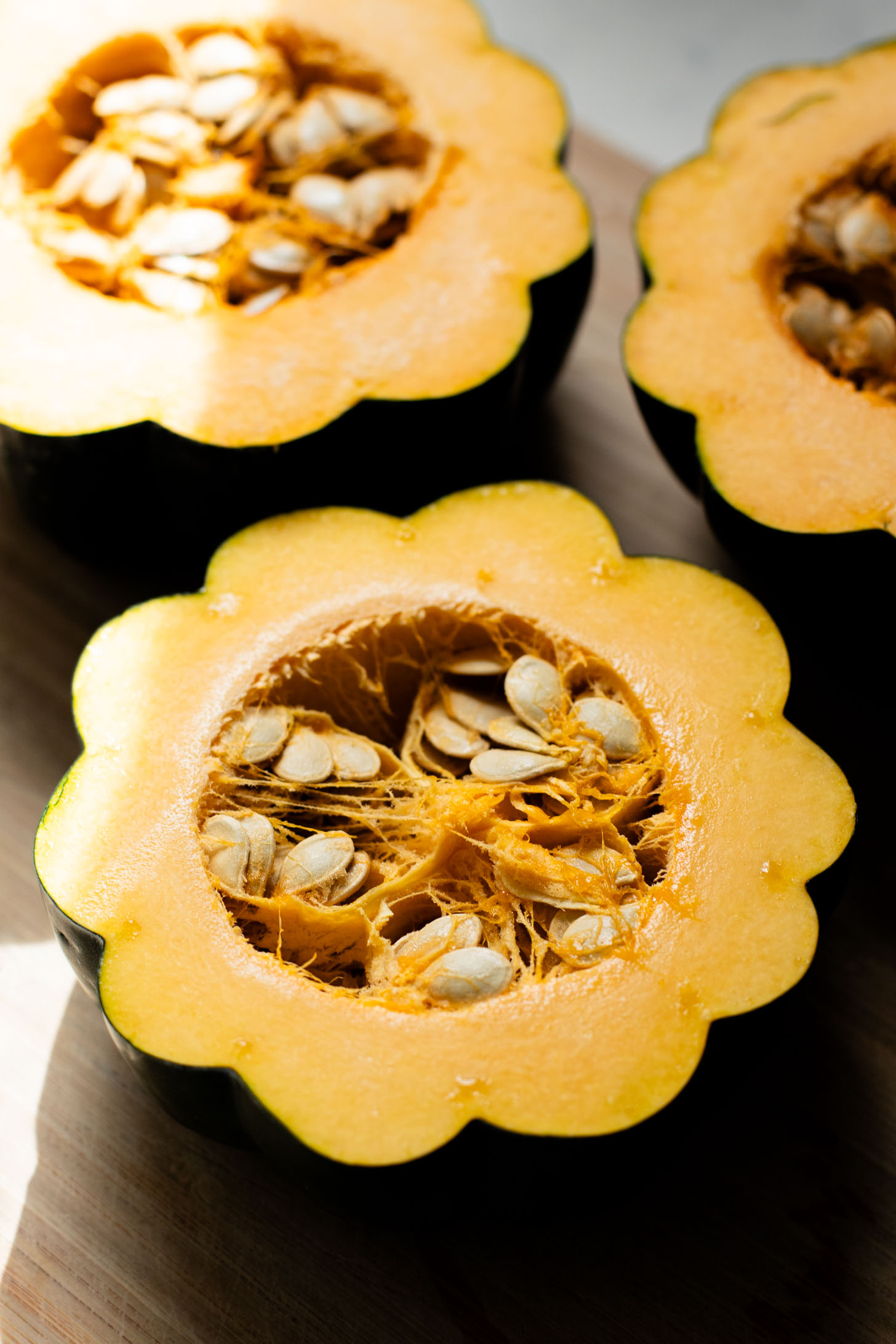 This Wild Rice Stuffed Acorn Squash recipe is filled with fall flavors. The squash is roasted until tender and stuffed with wild rice & chickpeas | ThisSavoryVegan.com #fallrecipes #wildricerecipes #falldinnerideas