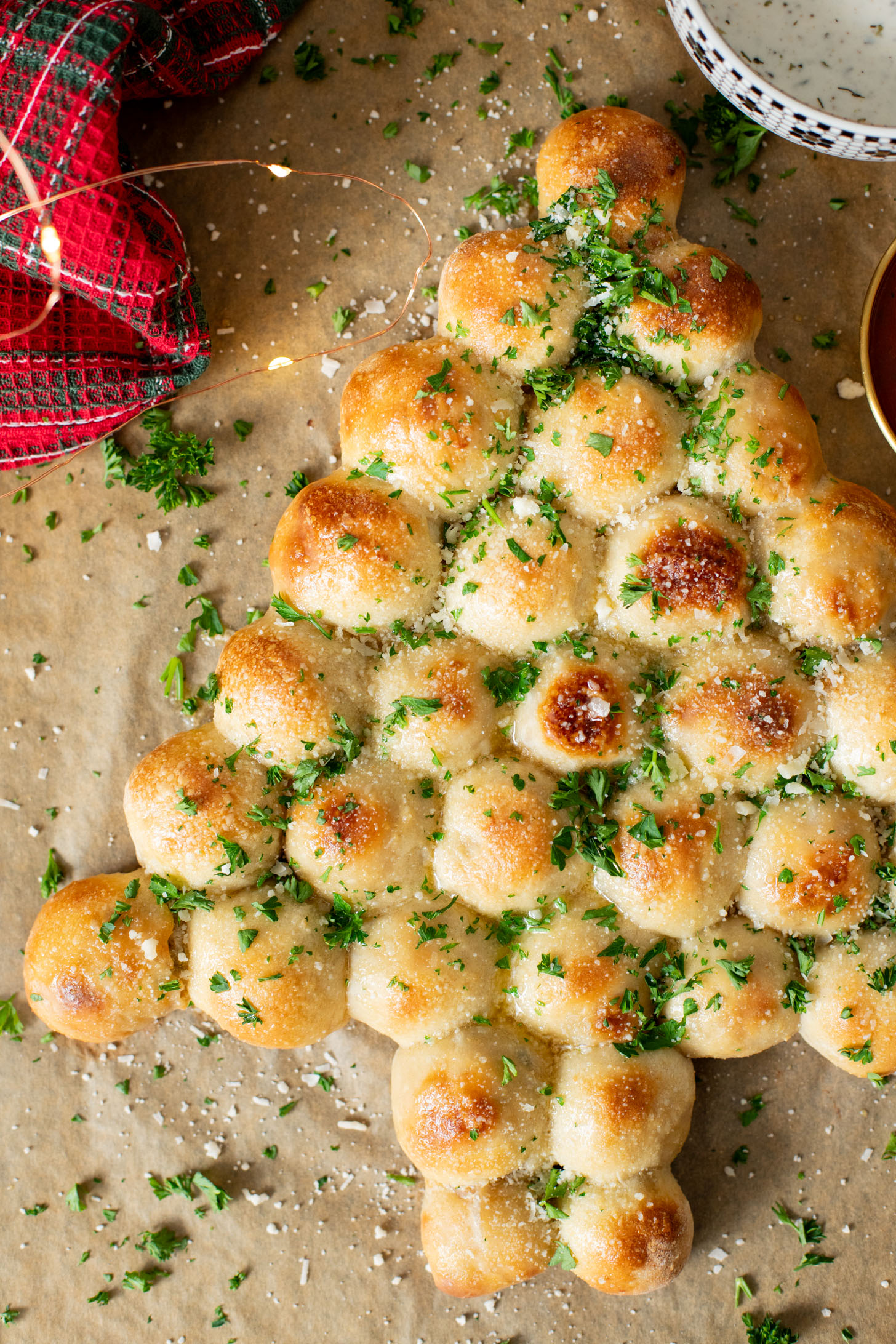 This Cheesy Pull-Apart Christmas Tree is pizza dough balls that are stuffed with a vegan jalapeño popper mixture. Perfect holiday appetizer | ThisSavoryVegan.com #thissavoryvegan #christmasappetizers #christmasrecipes