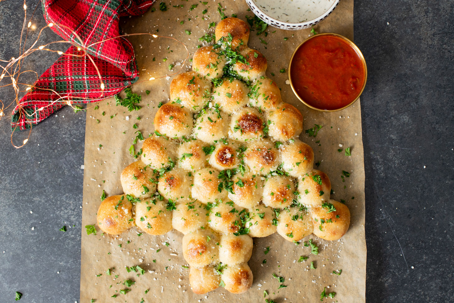 This Cheesy Pull-Apart Christmas Tree is pizza dough balls that are stuffed with a vegan jalapeño popper mixture. Perfect holiday appetizer | ThisSavoryVegan.com #thissavoryvegan #christmasappetizers #christmasrecipes