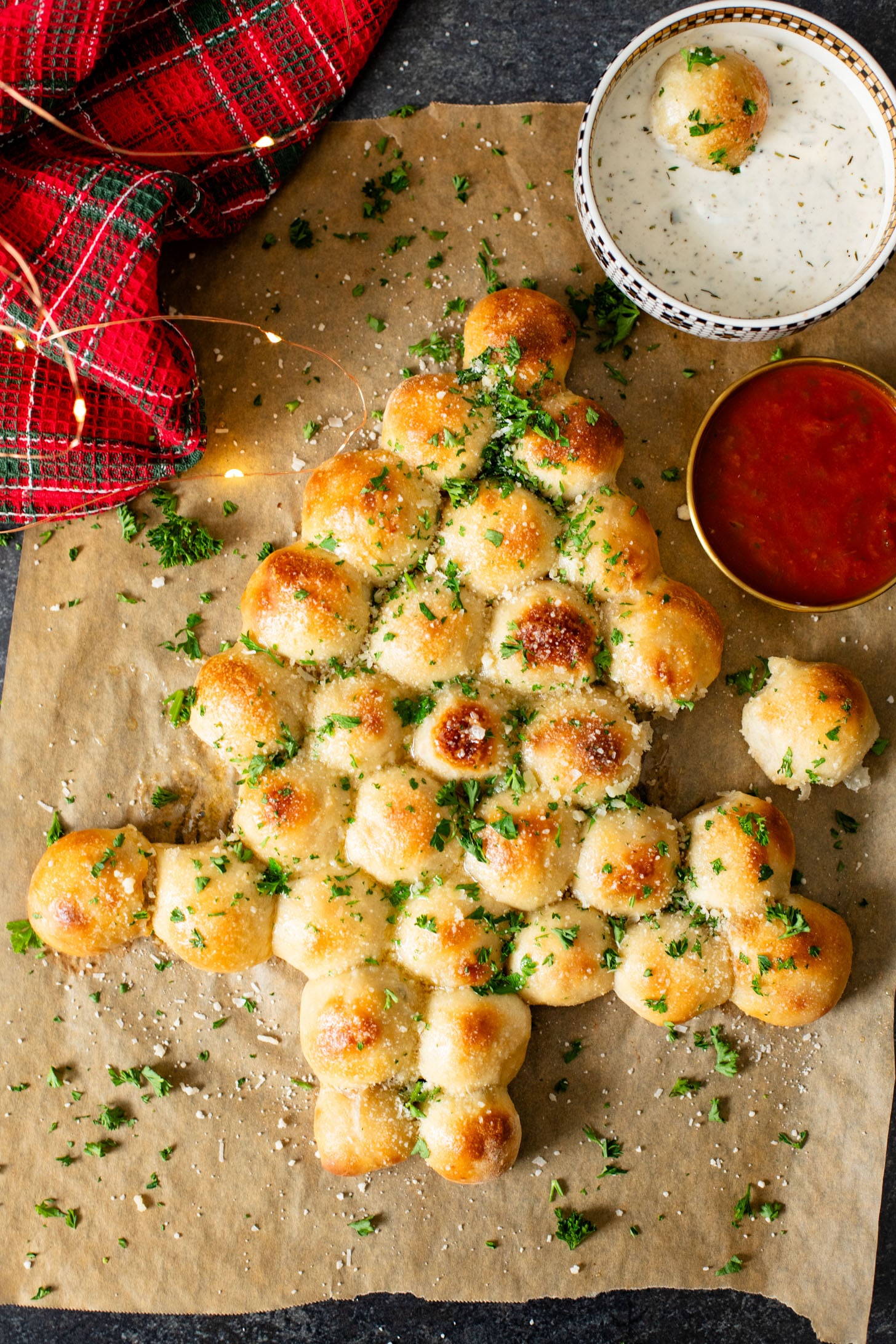 This Cheesy Pull-Apart Christmas Tree is pizza dough balls that are stuffed with a vegan jalapeño popper mixture. Perfect holiday appetizer | ThisSavoryVegan.com #thissavoryvegan #christmasappetizers #christmasrecipes
