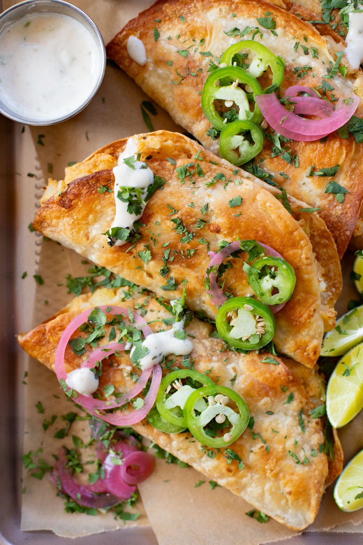 These Oven Baked Potato Tacos have a crispy outside & seasoned mashed potatoes inside. A perfect weeknight dinner when you want something easy | ThisSavoryVegan.com #thissavoryvegan #vegantacos #potatotacos
