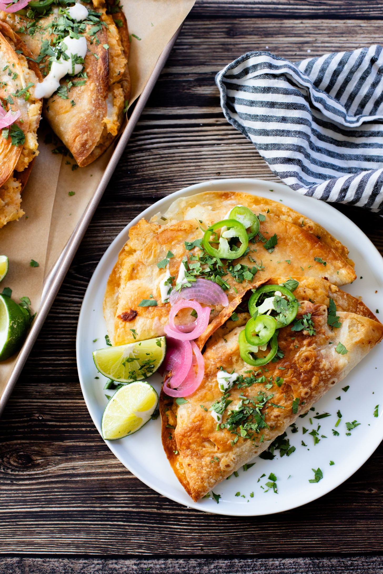 These Oven Baked Potato Tacos have a crispy outside & seasoned mashed potatoes inside. A perfect weeknight dinner when you want something easy | ThisSavoryVegan.com #thissavoryvegan #vegantacos #potatotacos