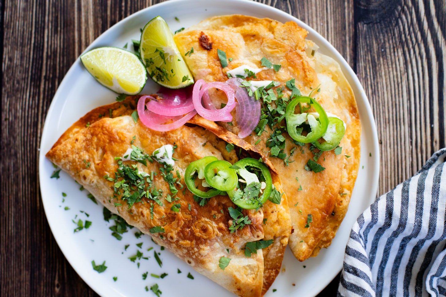 These Oven Baked Potato Tacos have a crispy outside & seasoned mashed potatoes inside. A perfect weeknight dinner when you want something easy | ThisSavoryVegan.com #thissavoryvegan #vegantacos #potatotacos