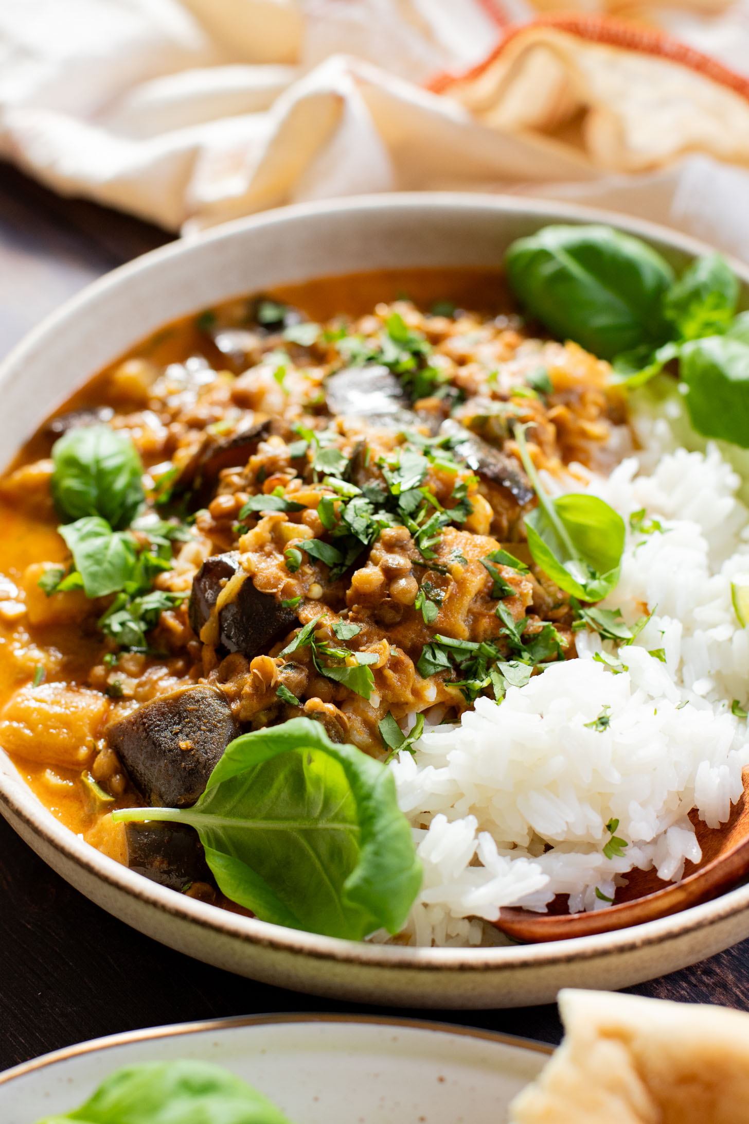 This Simple Eggplant Lentil Curry is made in one-pot with a red curry coconut broth. A flavor-packed and delicious vegan dinner idea | ThisSavoryVegan.com #thissavoryvegan #lentilcurry #vegancurry