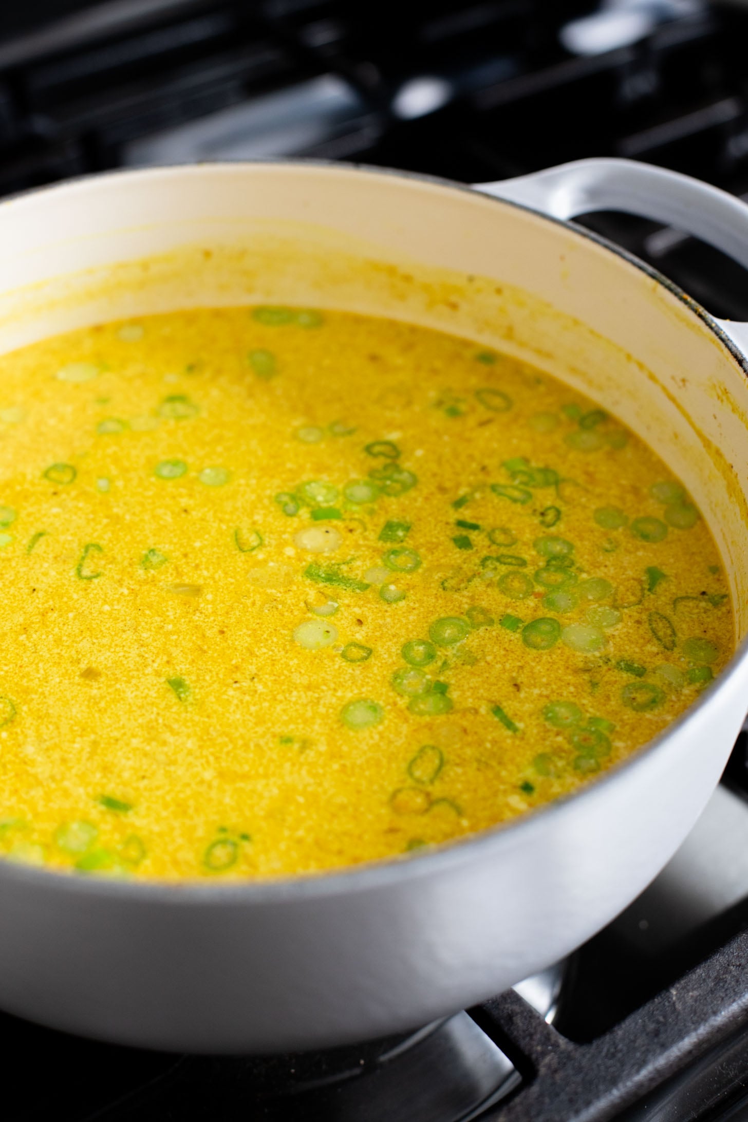 This Golden Coconut Noodle Soup is healthy & heart warming. A coconut curry broth, crispy baked tofu & tender rice noodles | ThisSavoryVegan.com #vegansoup #noodlesoup #healthysoup