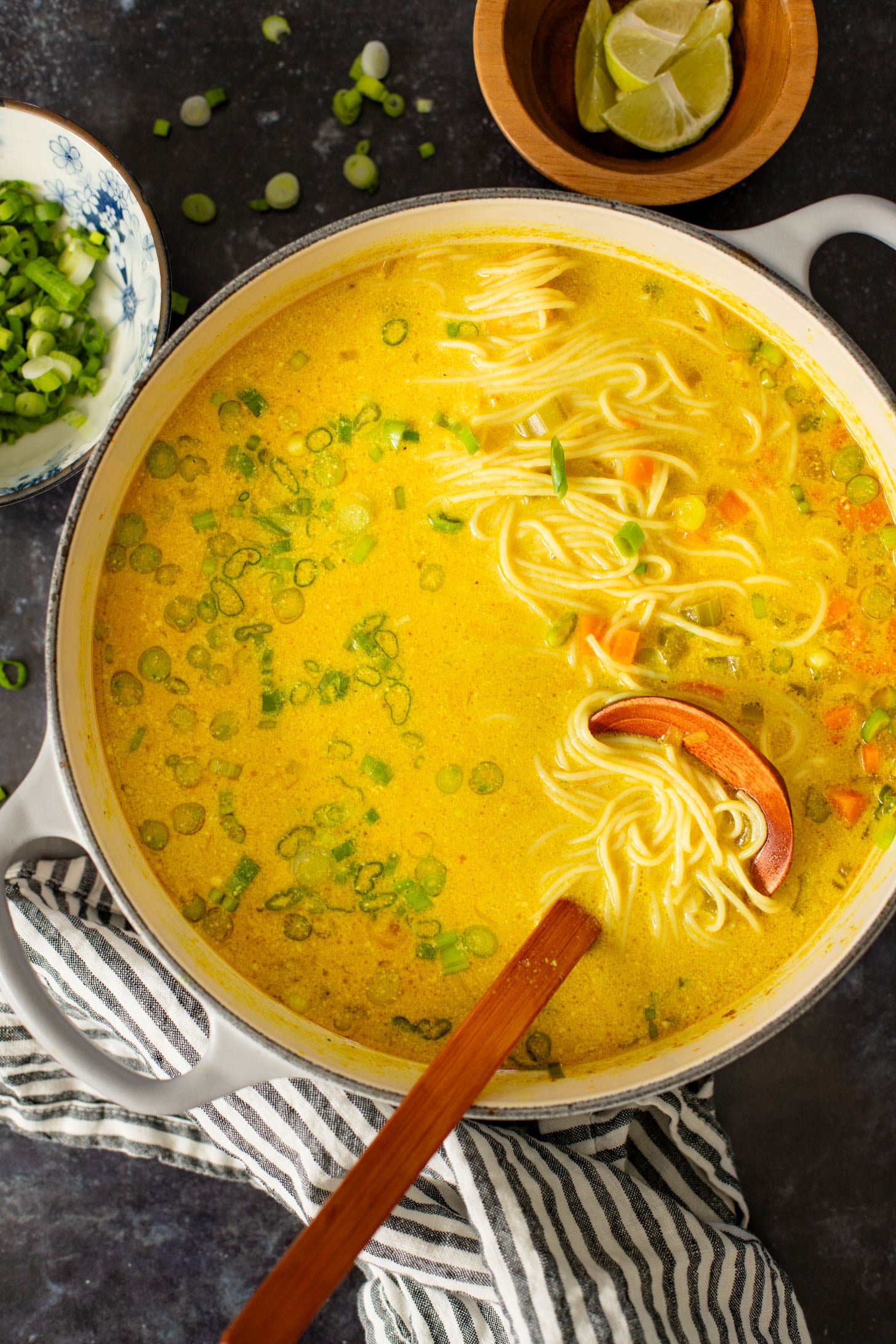 This Golden Coconut Noodle Soup is healthy & heart warming. A coconut curry broth, crispy baked tofu & tender rice noodles | ThisSavoryVegan.com #vegansoup #noodlesoup #healthysoup