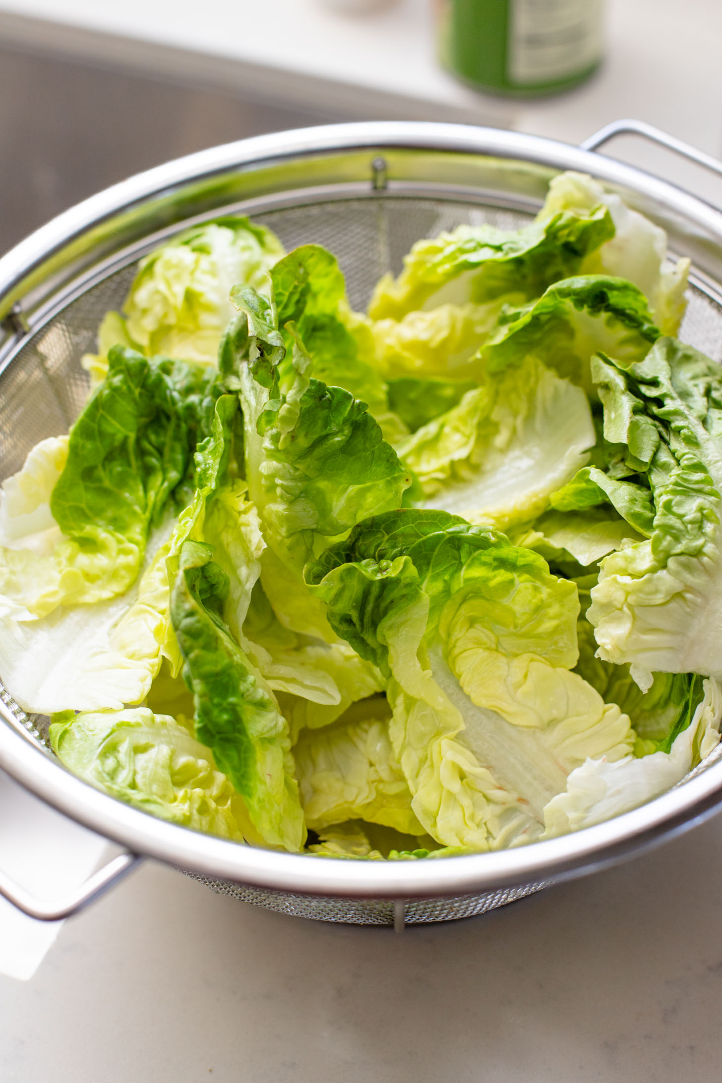 This Little Gem Caesar Salad is made with the best vegan Caesar dressing, garlic chickpea breadcrumbs, avocado slices & vegan parm | ThisSavoryVegan.com #vegancaesar #glutenfree #easysalads
