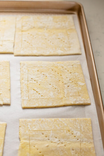 The perfect holiday appetizer - these Puff Pastry Potato Tarts have flakey crust, a creamy non-dairy spread & crispy rosemary potatoes | ThisSavoryVegan.com #thissavoryvegan #thanksgivingappetizers #holidaypartyfood