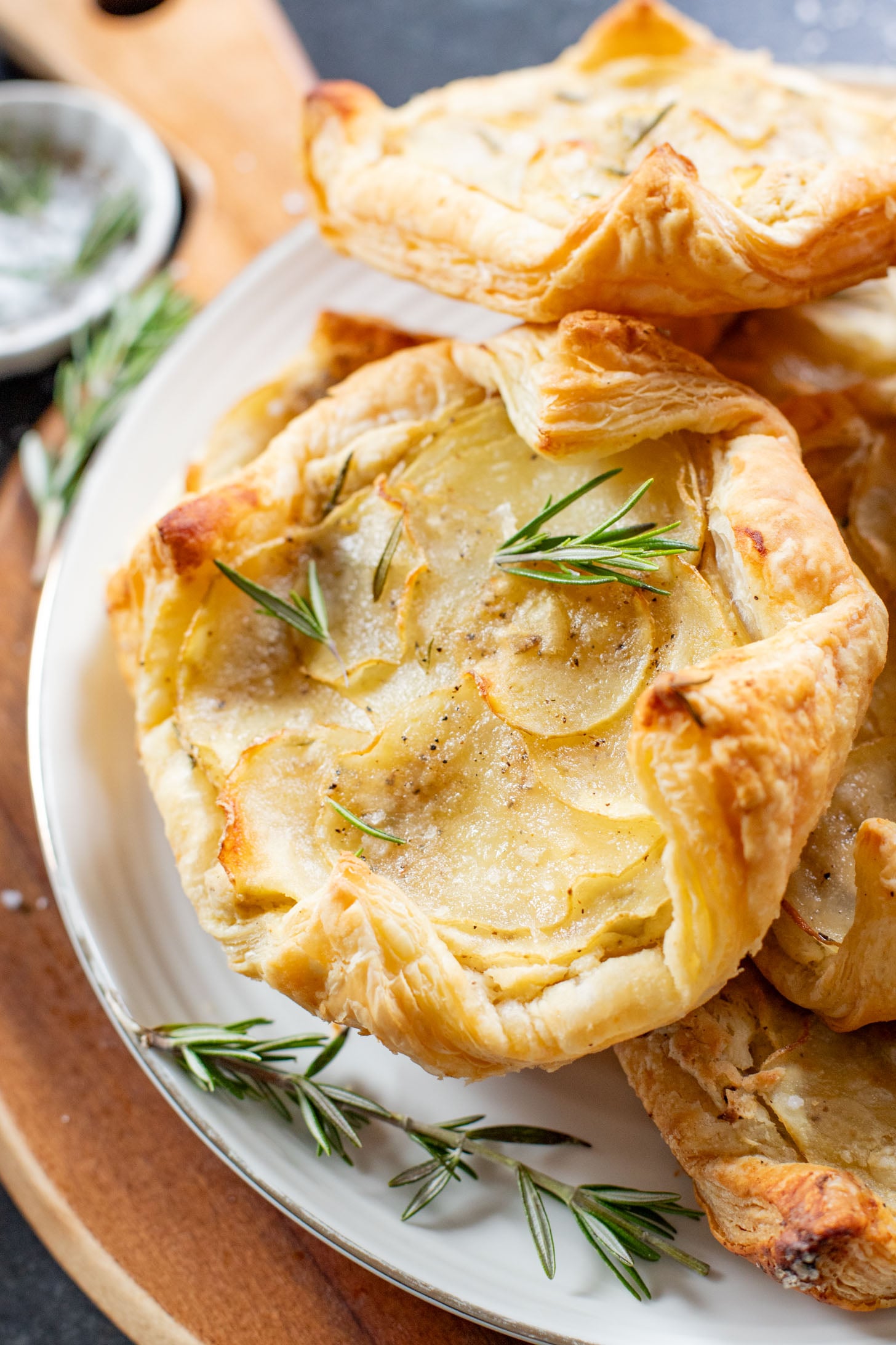 The perfect holiday appetizer - these Puff Pastry Potato Tarts have flakey crust, a creamy non-dairy spread & crispy rosemary potatoes | ThisSavoryVegan.com #thissavoryvegan #thanksgivingappetizers #holidaypartyfood