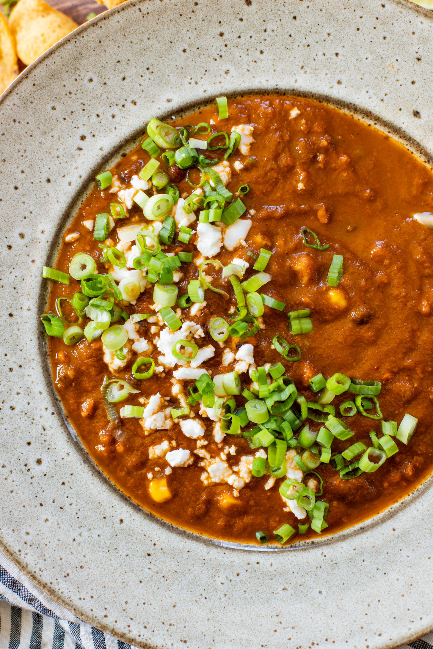 This Roasted Poblano Soup is made with simple ingredients and comes together quickly. Roasted veggies, crispy soyrizo & black beans | ThisSavoryVegan.com #thissavoryvegan #vegansoup #veggiesoup