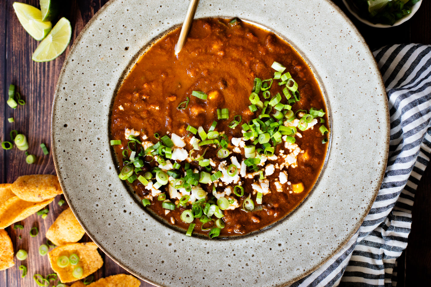 This Roasted Poblano Soup is made with simple ingredients and comes together quickly. Roasted veggies, crispy soyrizo & black beans | ThisSavoryVegan.com #thissavoryvegan #vegansoup #veggiesoup
