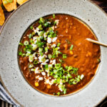 This Roasted Poblano Soup is made with simple ingredients and comes together quickly. Roasted veggies, crispy soyrizo & black beans | ThisSavoryVegan.com #thissavoryvegan #vegansoup #veggiesoup