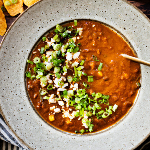 This Roasted Poblano Soup is made with simple ingredients and comes together quickly. Roasted veggies, crispy soyrizo & black beans | ThisSavoryVegan.com #thissavoryvegan #vegansoup #veggiesoup